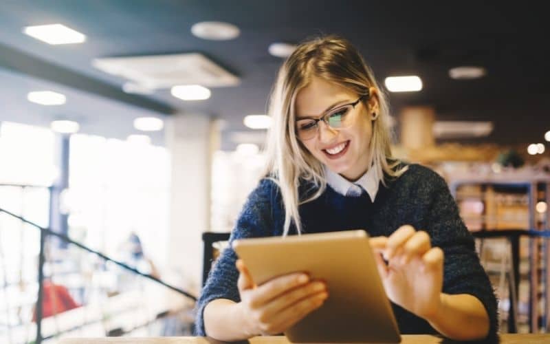 smiling woman with a tablet