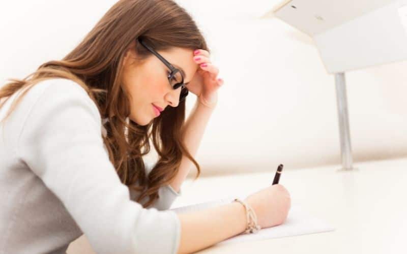 woman writing a cover letter
