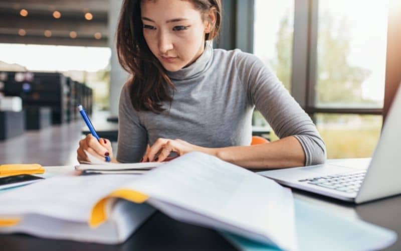 student studying in a library