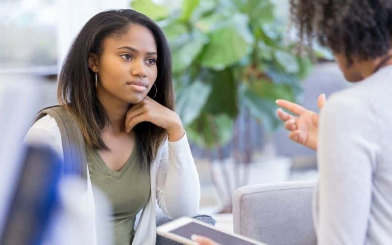 Guidance counselors talking to a student