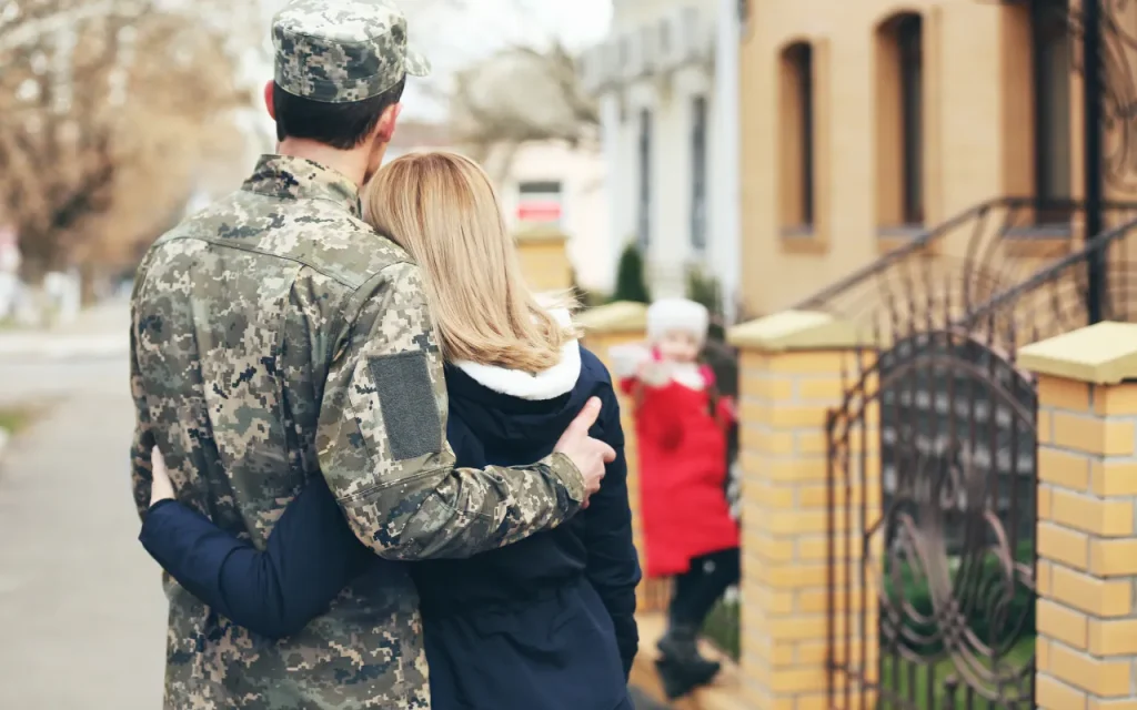 military spouse hugging partner