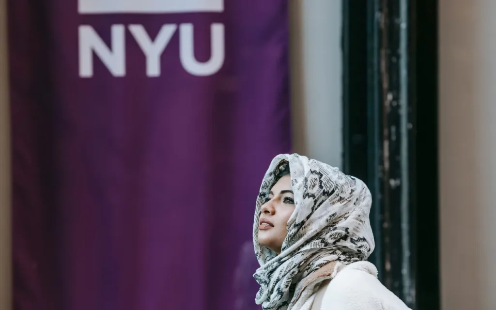 new york university campus with woman student walking