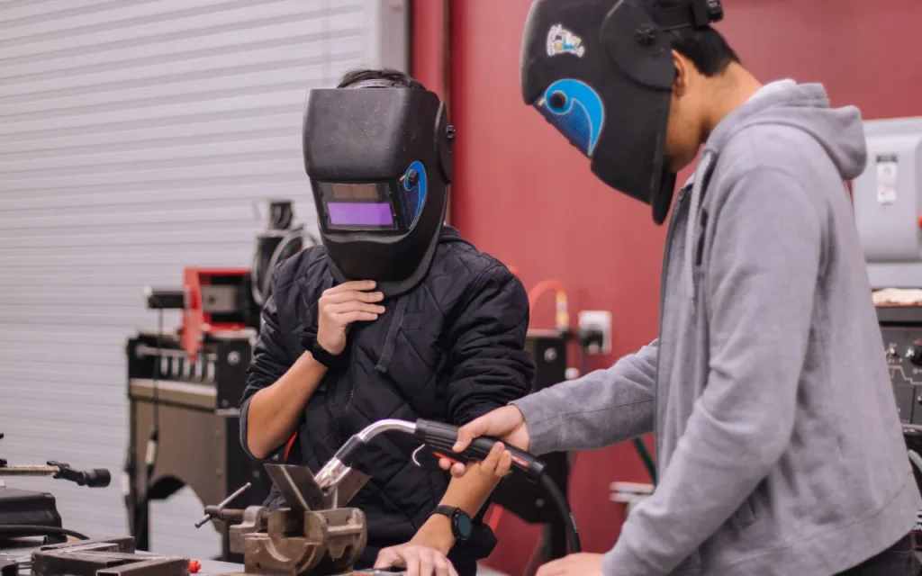 students welding