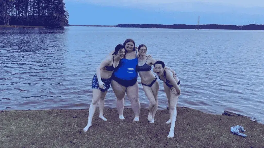 students hanging out on the water