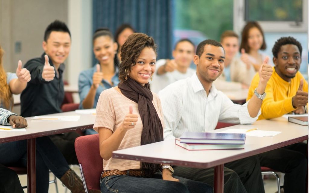 texas students give thumbs up sign in class