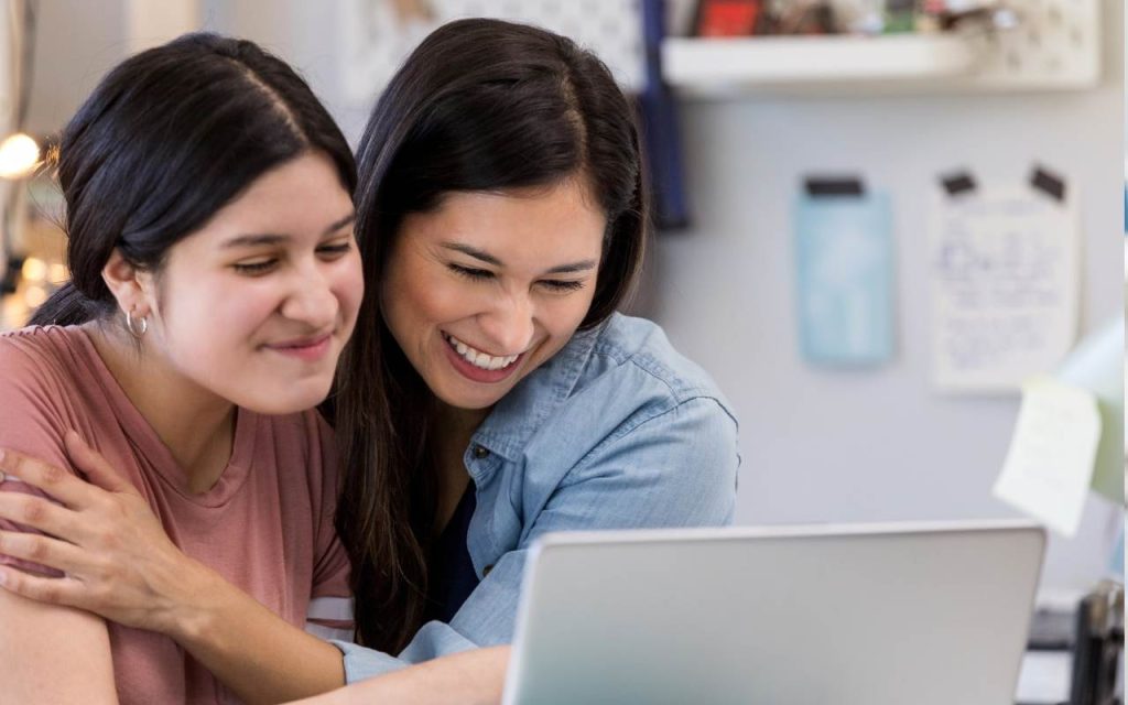 mother and daughter receive college acceptance email