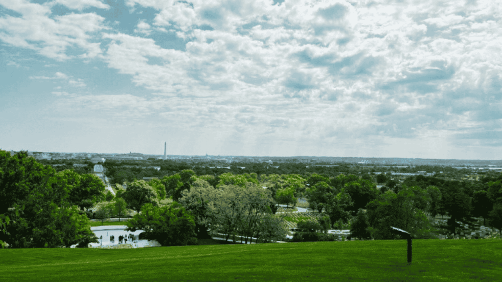 grassy field overlooking college campus