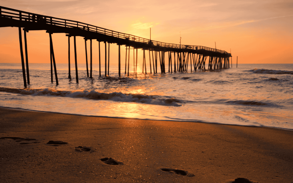 raised pier extends out over ocean