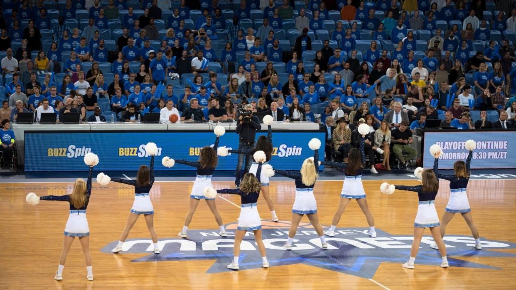 cheerleaders attend competition in school gymnasium