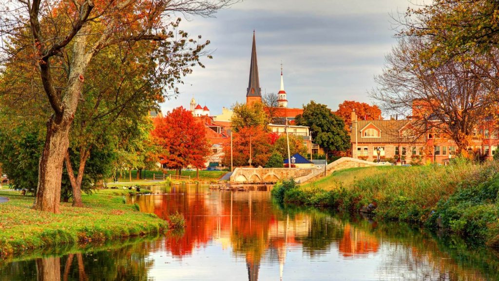 fall foliage in maryland reflected in a river