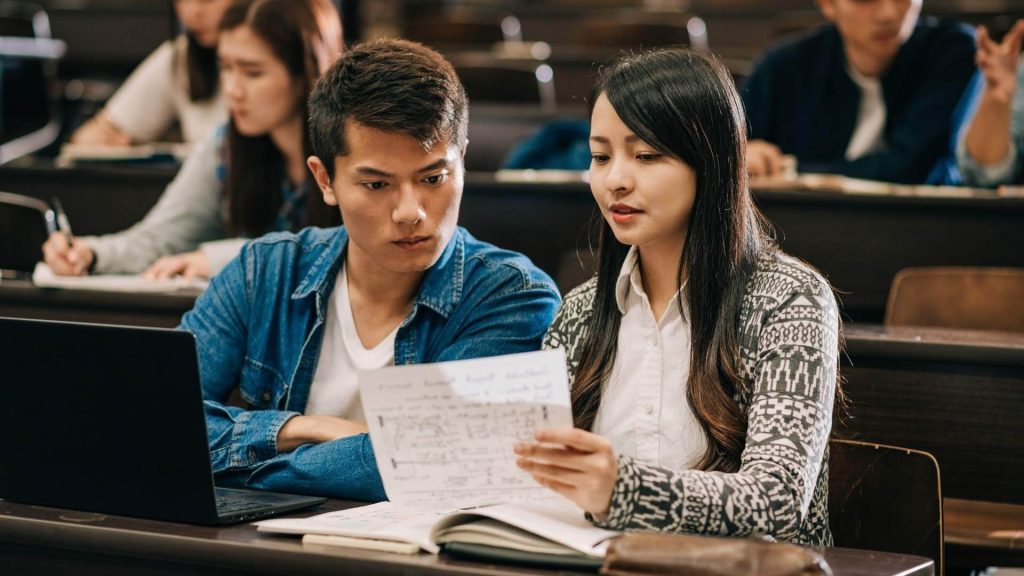 two asian students in lecture hall