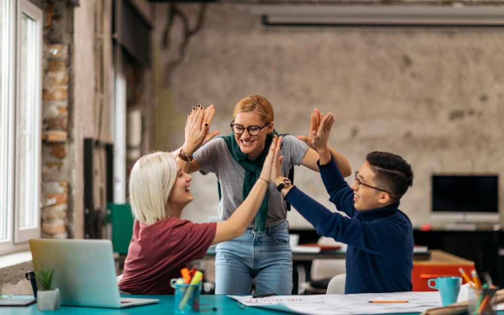 undergraduate students high five