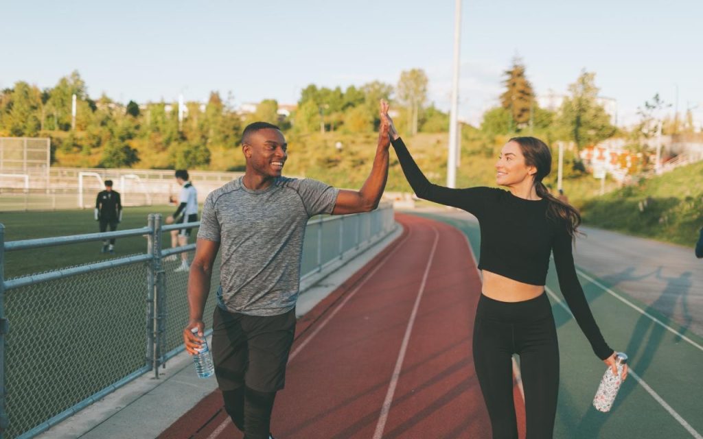 two track students celebrate a win